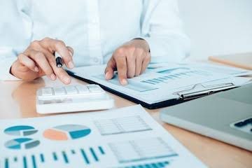 Photo: accounting service packages pricing plan and bookkeeping workspace