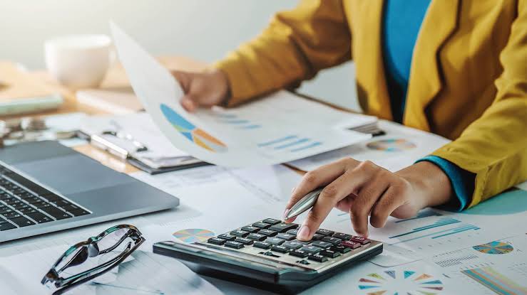 Photo: accounting bookkeeping monthly reports and financial records